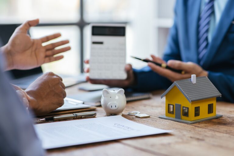 Close up Business people or Real Estate agent explain signing agreement for sale house to client